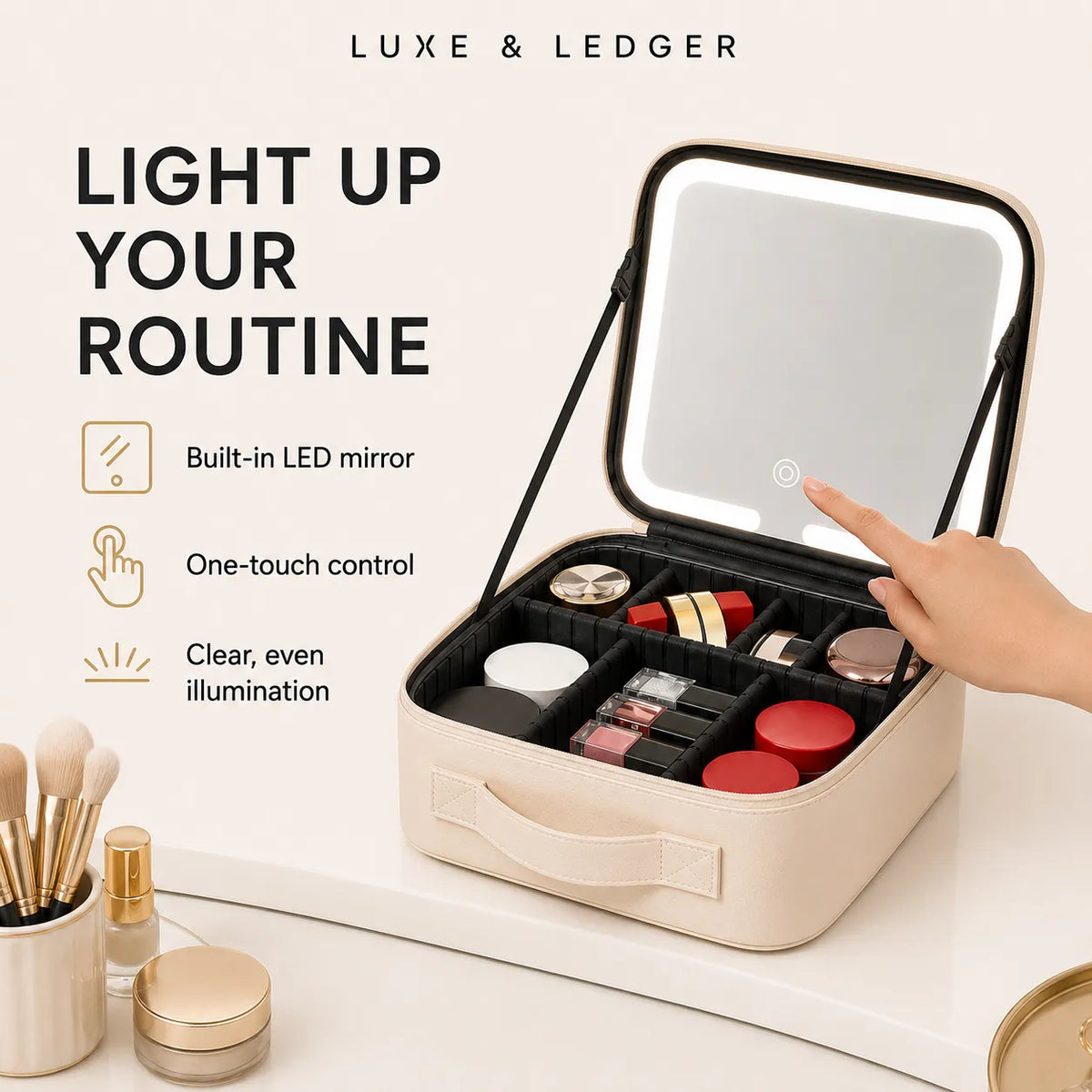 A beige LED makeup vanity case shown open on a white surface, with a hand touching the built-in mirror. The case contains organized cosmetics and is surrounded by cosmetic props.