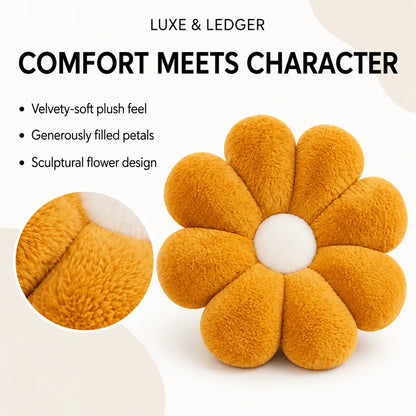 A flower-shaped plush cushion in a warm mustard yellow color with a white center, shown on a clean white background with promotional text and a circular close-up inset of the plush texture. Visible brand text at the top reads 'LUXE & LEDGER'.