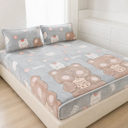 A plush gray bed sheet set with matching pillowcases, featuring a cute teddy bear and white bear pattern, styled on a bed in a bright, modern bedroom.