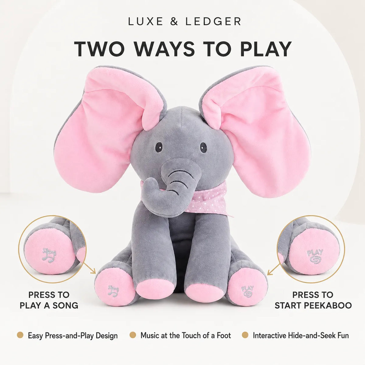 Peek-A-Boo Singing Elephant Pink variant — front product shot, grey plush with pink ears, ears spread wide open