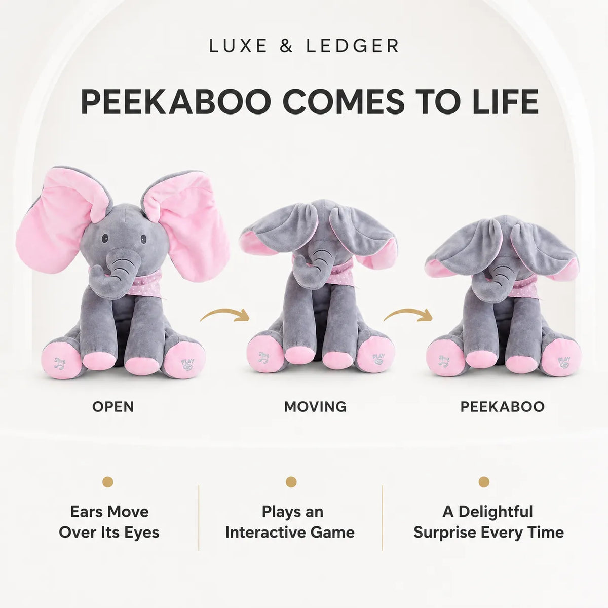 Peek-A-Boo Singing Elephant pink variant — front product shot, grey plush body with pink ears and scarf, music and play buttons on feet