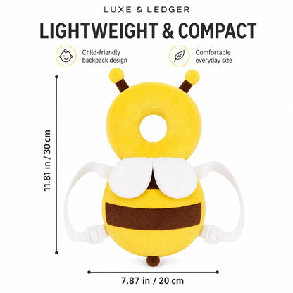 A yellow and brown plush bee backpack with white wings and straps, shown on a white background with text indicating dimensions: 11.81 in / 30 cm height and 7.