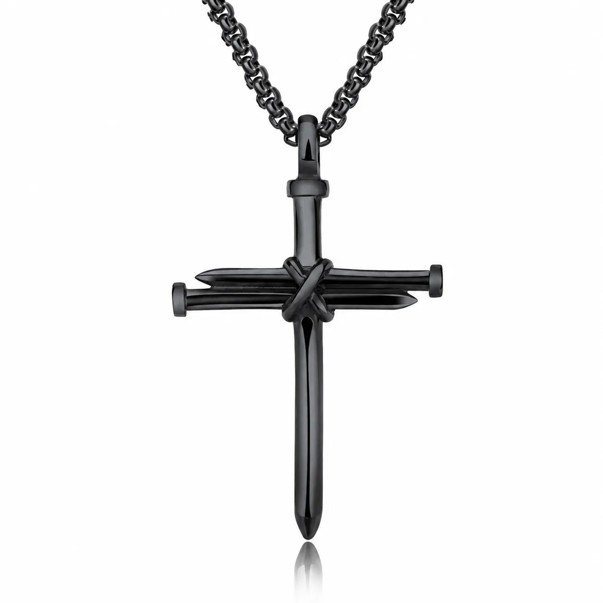 A black cross pendant necklace featuring a central crucifix design with nails, suspended from a matching black chain on a white background.