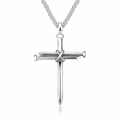 A silver cross pendant necklace featuring a vertical bar with two horizontal sword-like bars crossing at the center, suspended from a matching chain on a white background.
