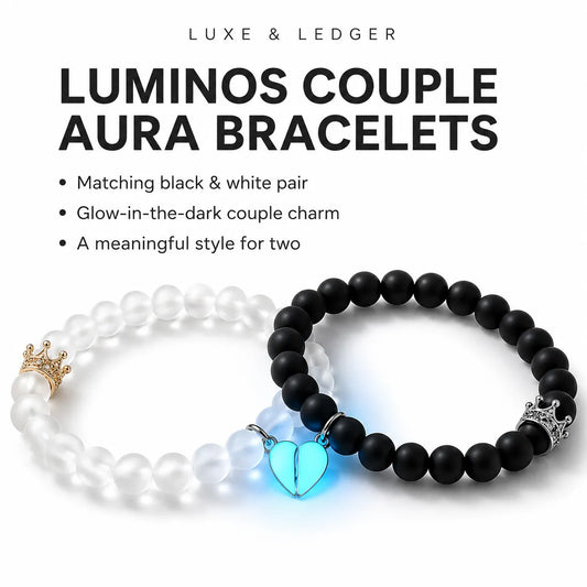 Two beaded couple bracelets displayed on a white background with text reading 'LUXE & LEDGER' and 'LUMINOS COUPLE AURA BRACELETS.' One bracelet is white with a small gold crown charm, and the other is black with a glowing blue heart charm.