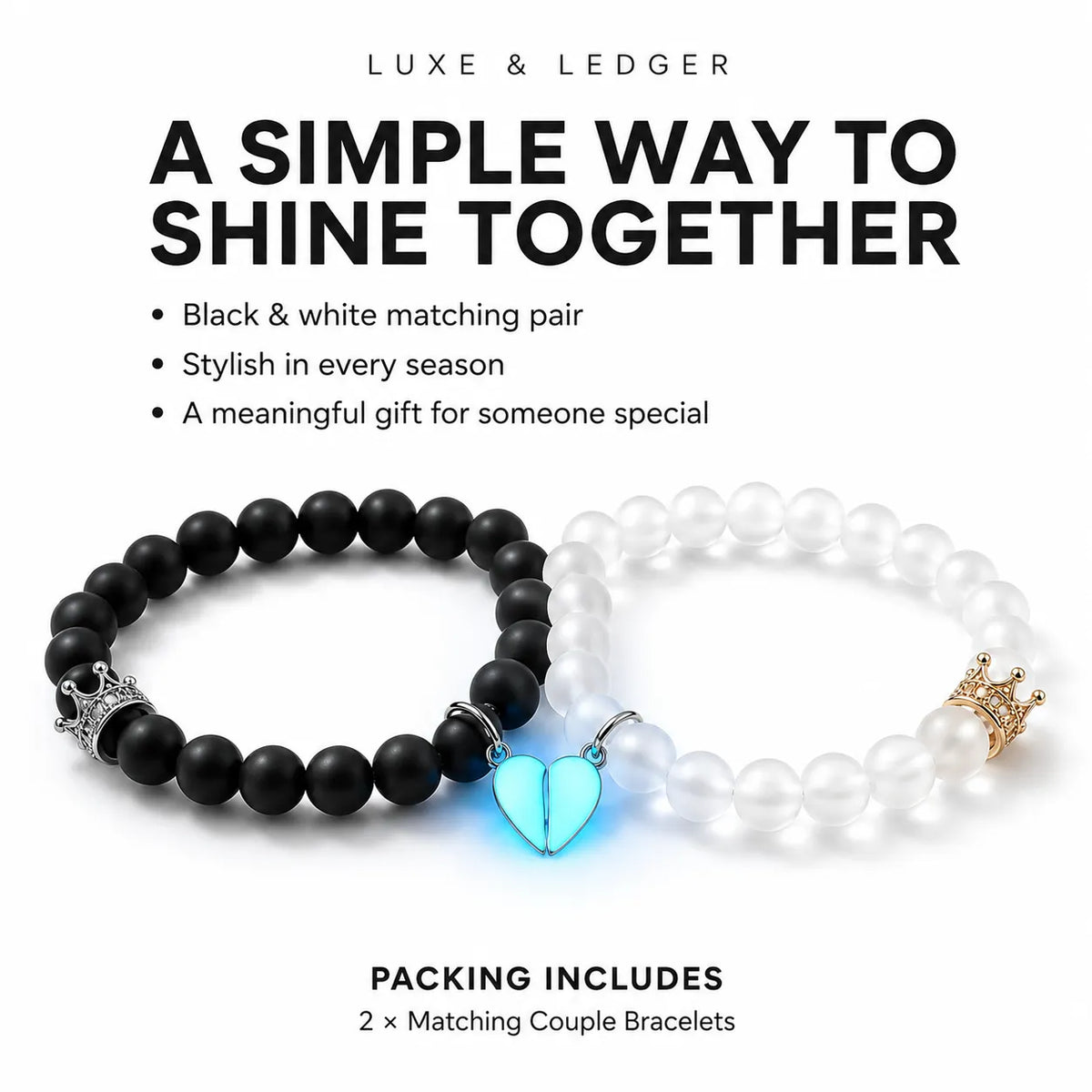 Two matching beaded stretch bracelets on a white background with promotional text. One bracelet is matte black with a glowing light-blue heart charm and silver crown detail, and the other is white with a pearl-like bead, gold crown detail, and a small silver heart charm.