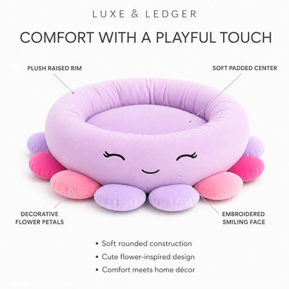 A plush octopus-shaped pet bed in pastel lavender, pink, and purple, shown on a white background with callout labels pointing to the raised rim, padded center, decorative flower petals, and smiling face. Text at the top reads 'LUXE & LEDGER' and 'COMFORT WITH A PLAYFUL TOUCH.