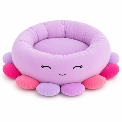 A cute, cloud-shaped plush pet bed in light purple with embroidered closed eyes and a smiling mouth, surrounded by colorful soft tentacles in pink, coral, and lavender on a white background.