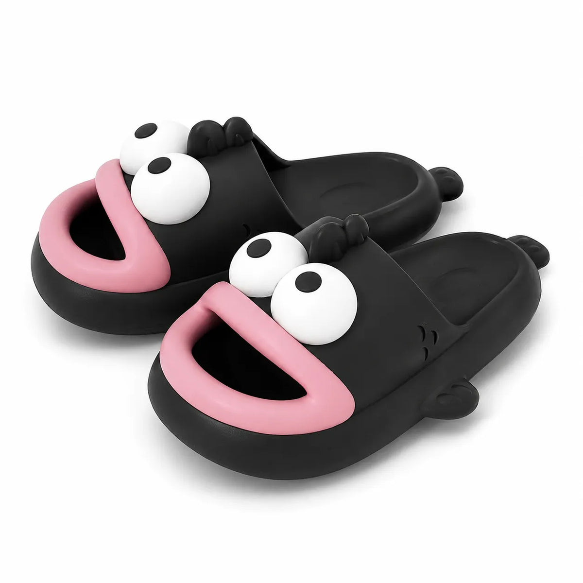 A pair of black slide sandals with a cartoon fish design, featuring large white eyes and pink mouths, shown on a clean white background.