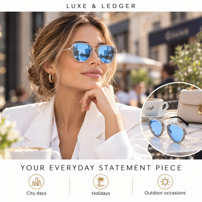 A woman wearing aviator-style sunglasses with reflective blue lenses and gold-toned frames, posed outdoors at a cafe. The image includes a circular inset showing the sunglasses alongside a handbag and coffee cup, with the text 'LUXE & LEDGER' at the top and 'YOUR EVERYDAY STATEMENT PIECE' at the bottom.