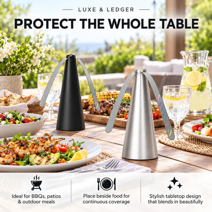 Two tabletop condiment spray bottles with long handles, one matte black and one brushed silver, displayed on an outdoor dining table with food and drinks. Large text at the top reads 'PROTECT THE WHOLE TABLE' and a banner at the bottom includes feature icons and copy.