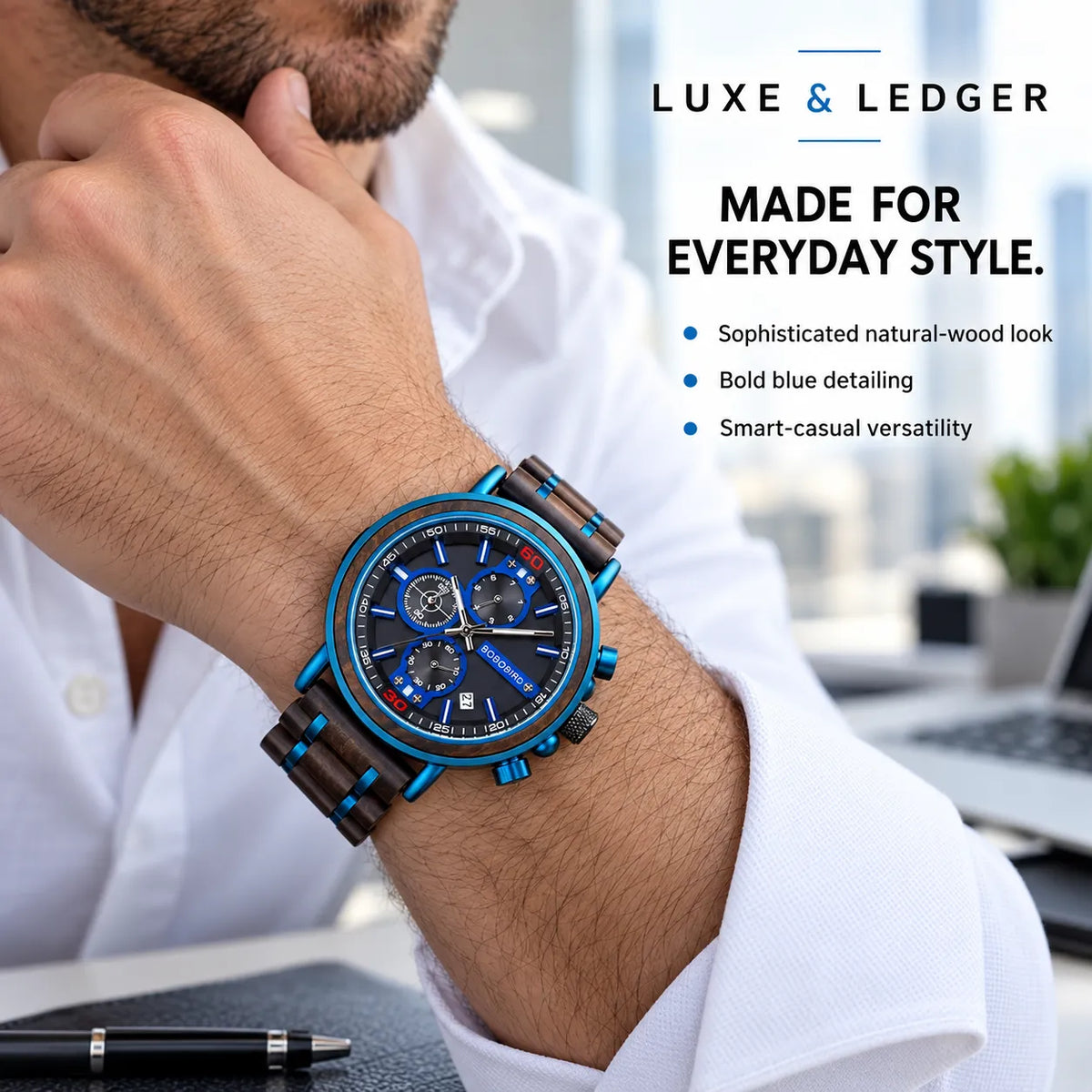 A man in a white shirt wearing a Luxe & Ledger men's watch with a blue dial and a brown wood-grain strap with blue accents, set against an office background with promotional text.