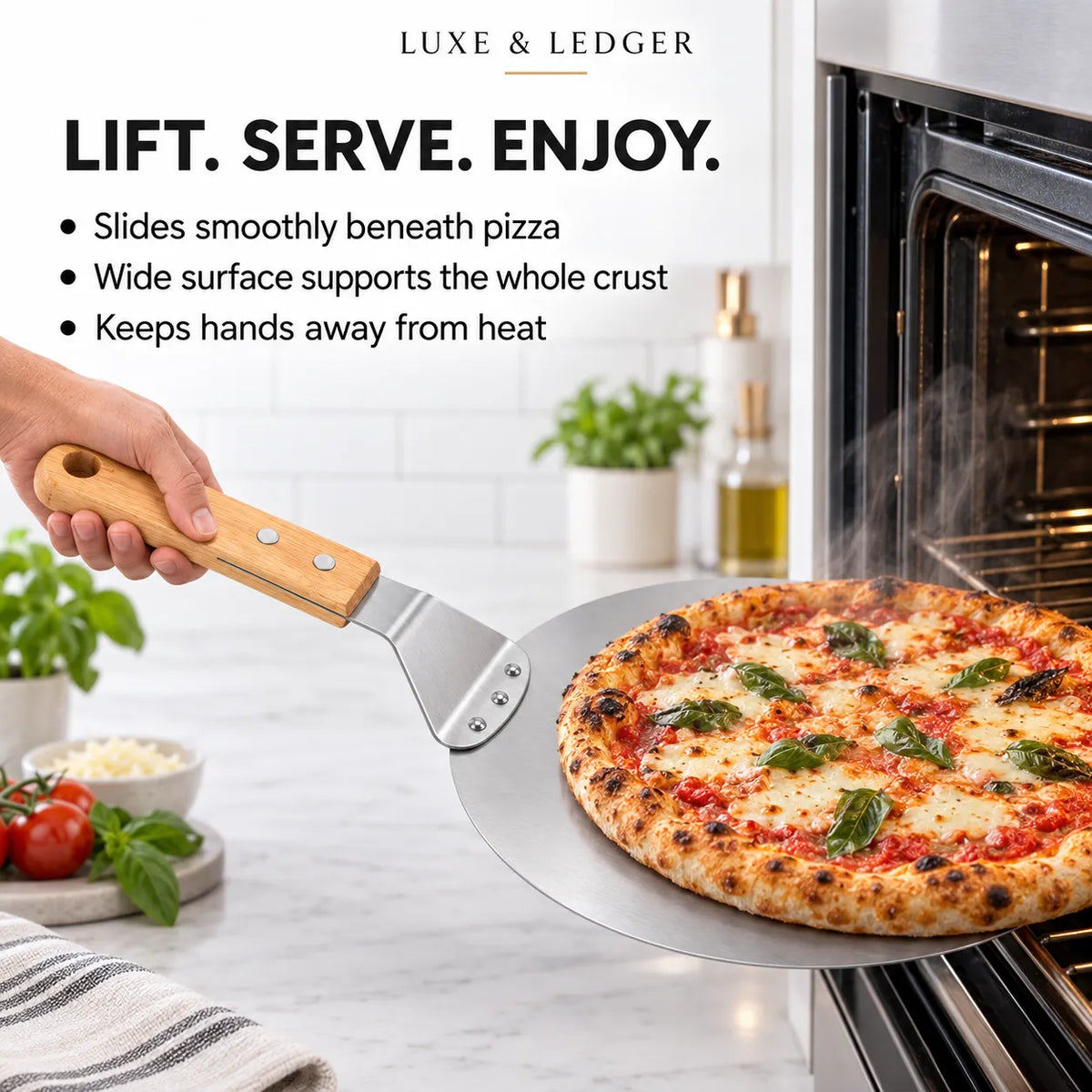 A hand holds a metal pizza peel with a wooden handle, sliding a freshly baked pizza into an oven. The scene is set in a bright kitchen with text overlays highlighting the product's features.