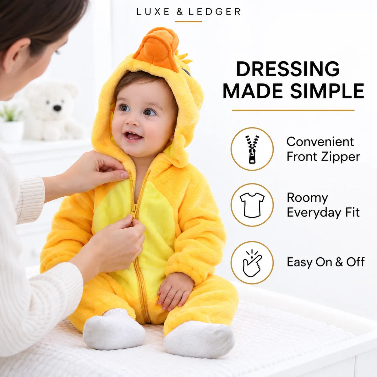 A baby wearing a yellow and orange duck costume onesie sits on a white bed while an adult adjusts the front zipper. The image includes marketing text and feature icons for the product.