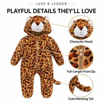 A children's leopard-print one-piece costume with a hood, front zipper, and matching tail, shown on a white background with callout circles highlighting the character hood, full-length front zip, and cute matching tail. Text at the top reads 'PLAYFUL DETAILS THEY'LL LOVE' and 'LUXE & LEDGER'.