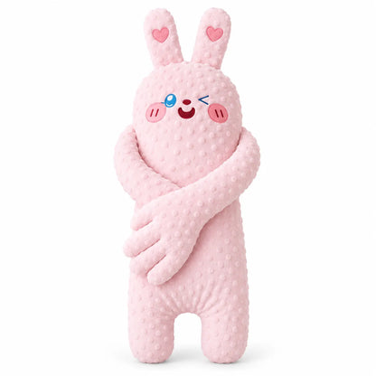 A pink plush bunny toy with a textured, dotted minky fabric, featuring embroidered eyes, a winking smiley face, pink cheeks, and heart details on its ears, set against a plain white background.
