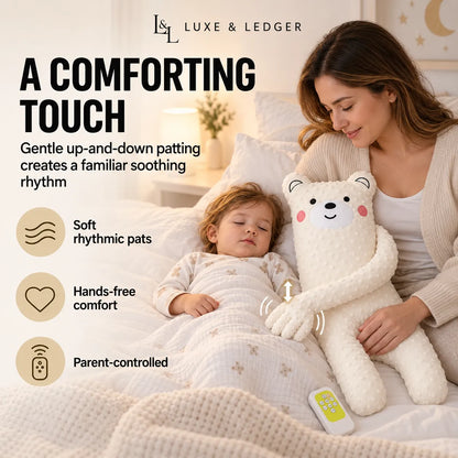 A woman in a cream knit sweater sits in bed beside a sleeping child while holding a plush cream bear-shaped baby comforter. The scene includes marketing text and feature icons for soft rhythmic pats, hands-free comfort, and parent-controlled use.