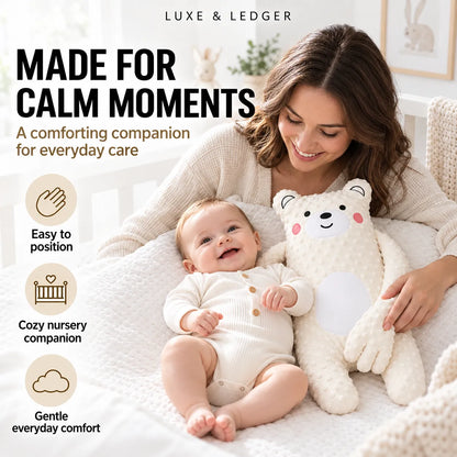 A baby in a cream onesie lies on a white blanket next to a woman in a knit cardigan, holding a large cream plush bear. The scene is softly lit and styled like a nursery, with promotional text on the left reading 'MADE FOR CALM MOMENTS' and 'Easy to position', plus the brand name Luxe & Ledger at the top.