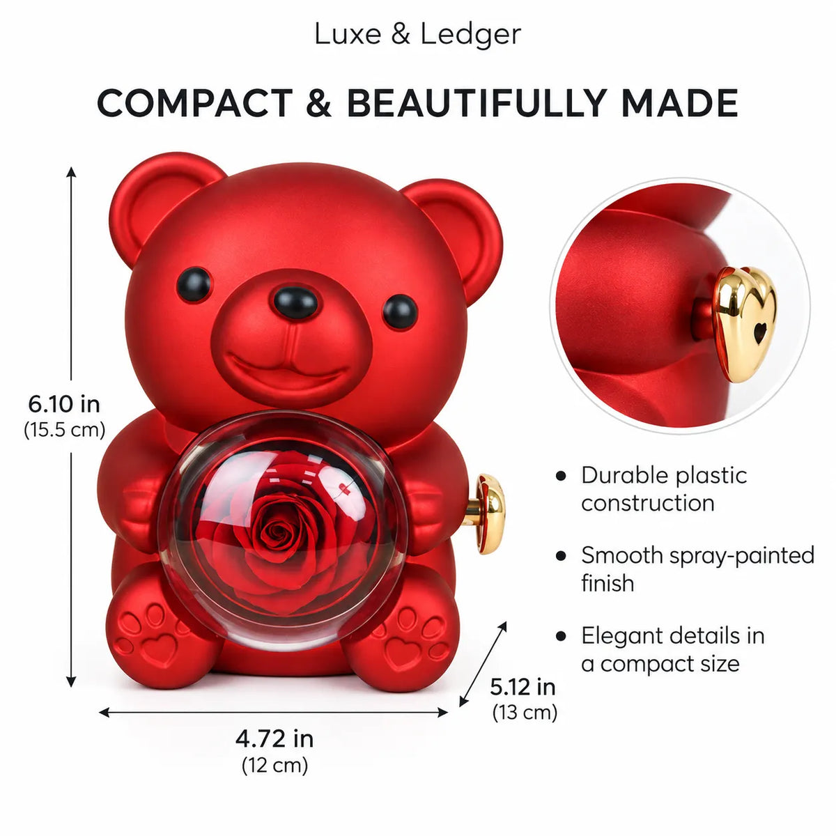 Red teddy bear-shaped compact with a clear circular window showing a red rose, labeled with dimensions and product features on a white background. Includes an inset close-up of a gold heart detail.