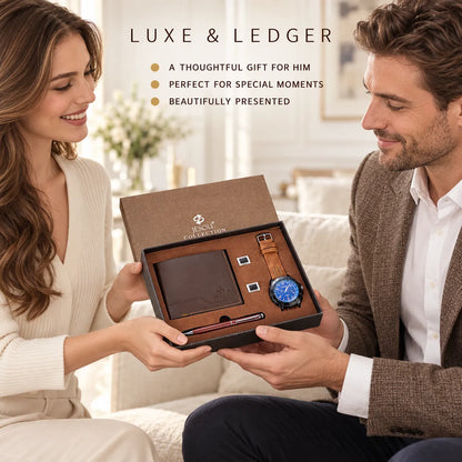 A man and woman sitting on a couch in a bright living room, holding an open luxury gift box together. The box contains a dark brown leather wallet, a watch with a blue dial and brown strap, and a slim red pen.