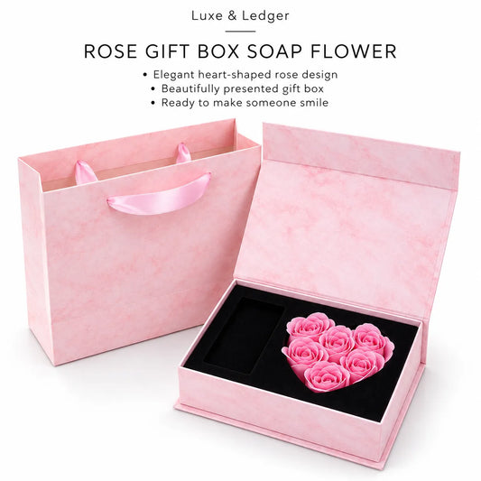 Pink rose gift box set with an open heart-shaped box containing a preserved pink rose arrangement and a matching pink gift bag, shown on a white background with product text at the top.
