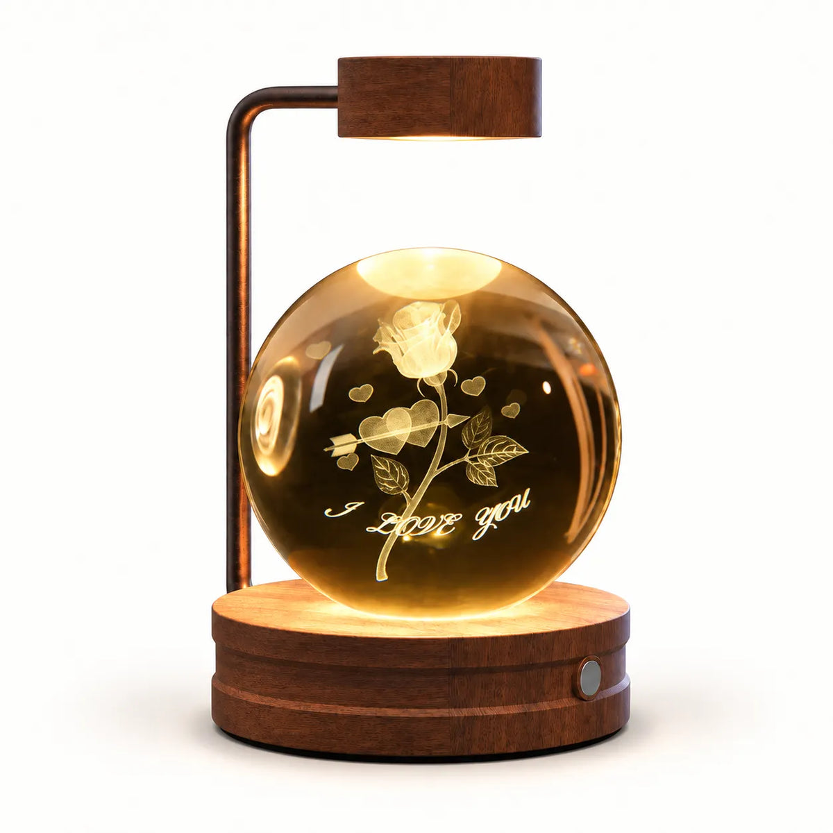 A modern LED magnetic crystal lamp featuring a glowing rose etched on a clear glass sphere, mounted on a round wooden base with a curved wooden arm and light box, shown against a plain white background.