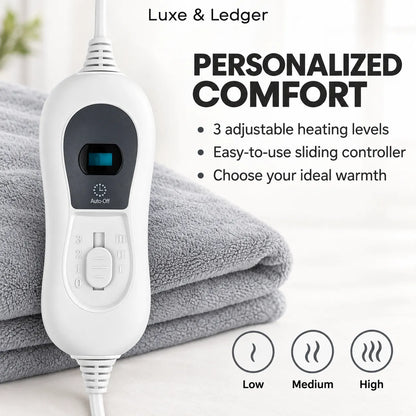 White Luxe & Ledger heated pad controller shown next to a folded gray towel, with text highlighting personalized comfort features and three heat level icons.