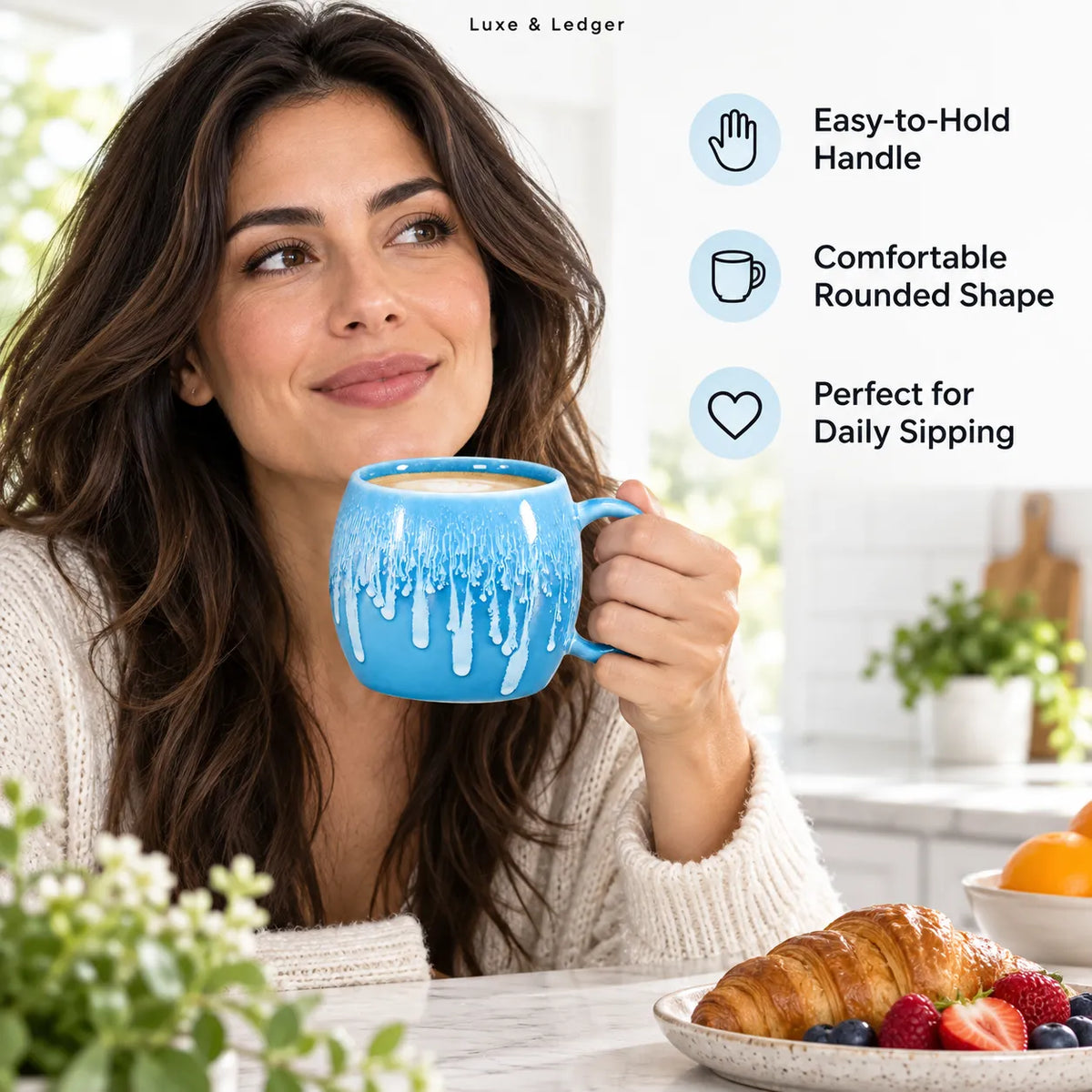 A woman in a cozy white sweater holds a bright blue ceramic mug with a dripping paint design, set in a bright kitchen. On the right, text highlights the mug's features: easy-to-hold handle, comfortable rounded shape, and perfect for daily sipping.