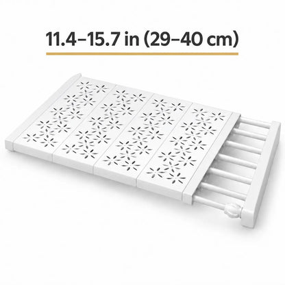 White plastic folding step stool with floral cutout patterns on the steps and a ladder-style side support, shown on a white background with text indicating dimensions 11.4-15.