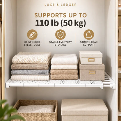 White metal closet shelf organizer shown inside a wardrobe, holding folded towels and storage boxes. Text at the top reads 'LUXE & LEDGER' and 'SUPPORTS UP TO 110 lb (50 kg)', with feature icons for reinforced steel tubes, stable everyday storage, and strong load support.