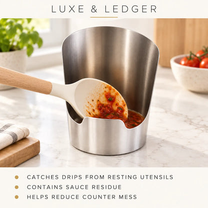 A stainless steel sauce drainer stand on a marble kitchen counter, with a white silicone spatula resting inside it and sauce residue collected at the bottom. Text at the top reads 'LUXE & LEDGER' and text at the bottom lists benefits about catching drips, containing sauce residue, and reducing counter mess.