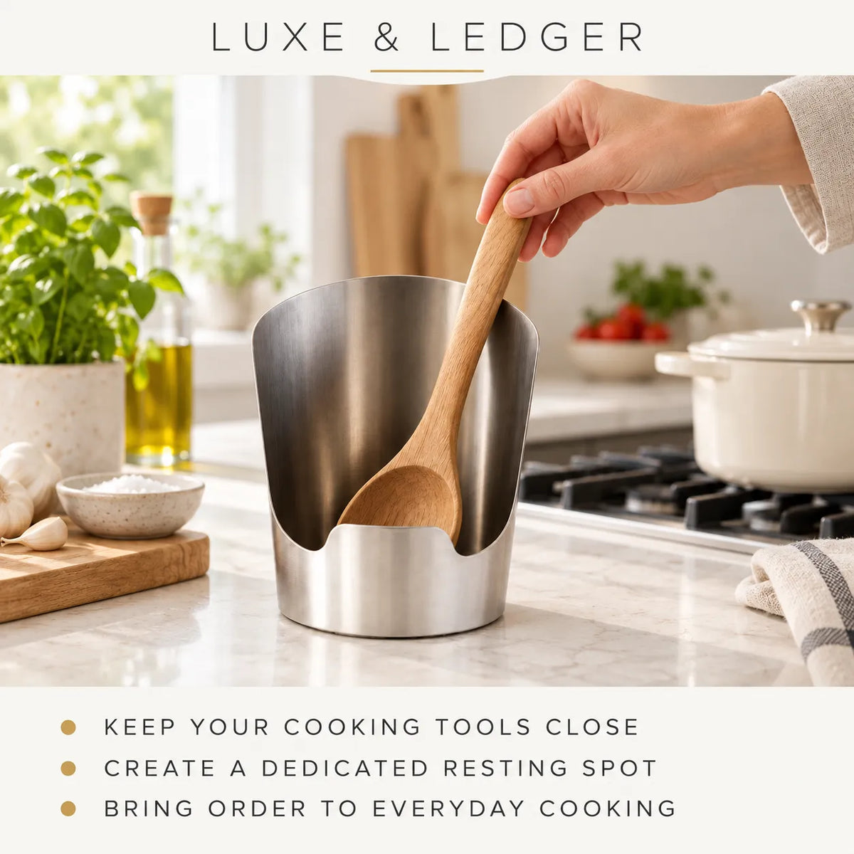 A stainless steel kitchen tool holder with a wooden spoon resting inside, shown on a kitchen countertop with a hand holding the spoon. The image includes the text 'LUXE & LEDGER' at the top and marketing copy at the bottom.