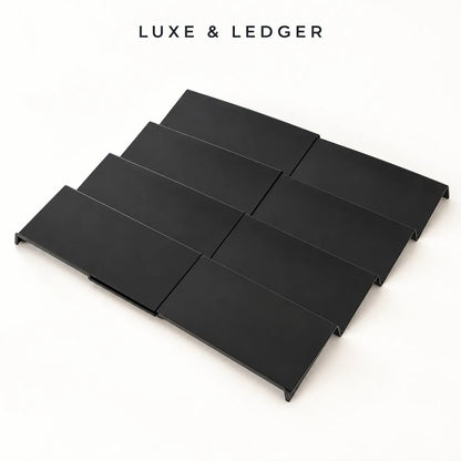 Six matte black rectangular shelf trays arranged in two rows of three on a clean white background, with the text 'LUXE & LEDGER' printed above.
