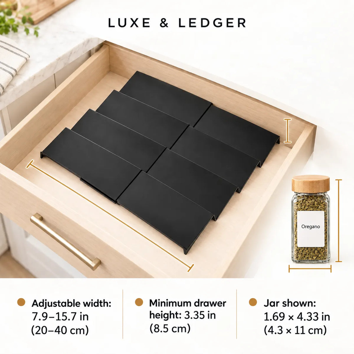 Black adjustable drawer organizer trays shown inside an open light wood drawer, with text reading 'LUXE & LEDGER' and dimension callouts plus a small jar inset labeled Oregano.