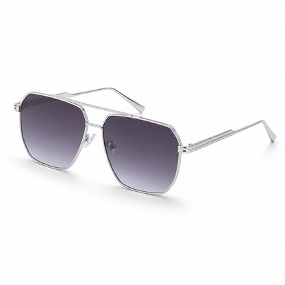 Sunglasses with black gradient lenses and gold frame on a white background