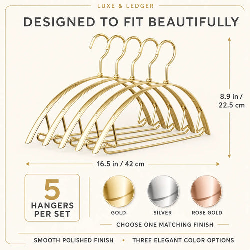 Gold metal hanger set with dimension labels, showing 5 hangers per set and three finish options: gold, silver, and rose gold. Text reads 'DESIGNED TO FIT BEAUTIFULLY' and 'LUXE & LEDGER'.