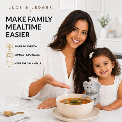 A woman and a young girl smile over a bowl of soup at a kitchen table, with a small gray elephant-shaped utensil resting on the bowl. The scene includes marketing text reading 'LUXE & LEDGER' and 'MAKE FAMILY MEALTIME EASIER,' plus feature icons and a spoon on the table.