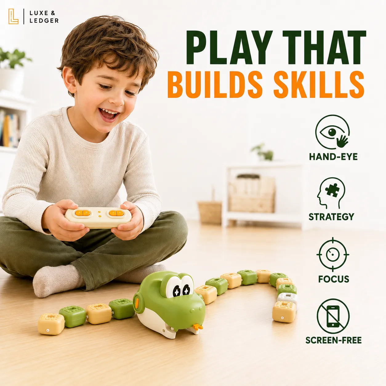 A young boy sits cross-legged on a wooden floor, smiling while holding a white controller for a green snake-shaped toy with block segments. The scene is brightly lit and styled as a home interior, with large text reading 'PLAY THAT BUILDS SKILLS' and feature icons for hand-eye, strategy, focus, and screen-free use.