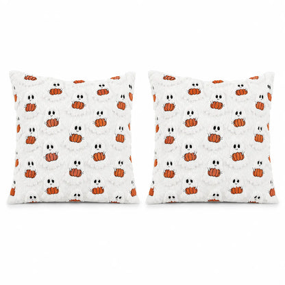 Two square white throw pillows with a repeating Halloween pattern of orange pumpkins and white ghosts, shown side by side on a plain white background.
