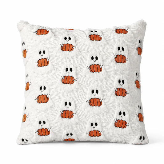 A square white throw pillow with a textured, raised waffle-like pattern, featuring a repeating motif of cute orange pumpkins with black eyes and mouths.