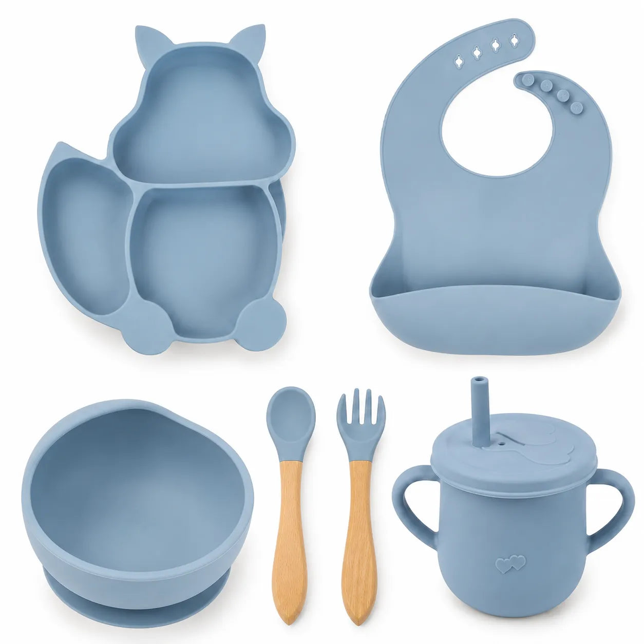 A 6-piece baby feeding set in a dusty blue color, including an owl-shaped divided plate, a curved bib, a bowl with suction base, a lidded sippy cup with handle and straw, a wooden spoon, and a wooden fork with blue silicone tips, all arranged on a white background.
