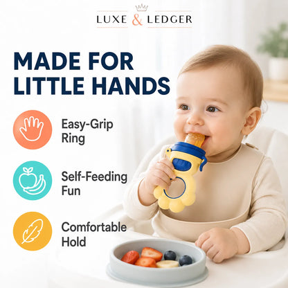 A baby in a cream outfit sits in a high chair holding a yellow and blue LUXE & LEDGER teething ring with a fruit piece, next to a bowl of fruit. The left side features marketing text reading 'MADE FOR LITTLE HANDS' with icons for 'Easy-Grip Ring', 'Self-Feeding Fun', and 'Comfortable Hold'.