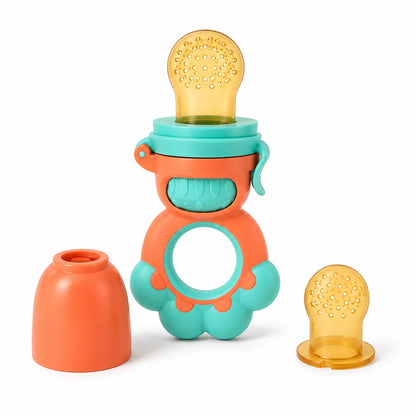 A baby teething fruit feeder toy with a bright orange body, teal accents, and a translucent amber-yellow silicone pouch, shown with its removable cap and detached pouch on a white background.