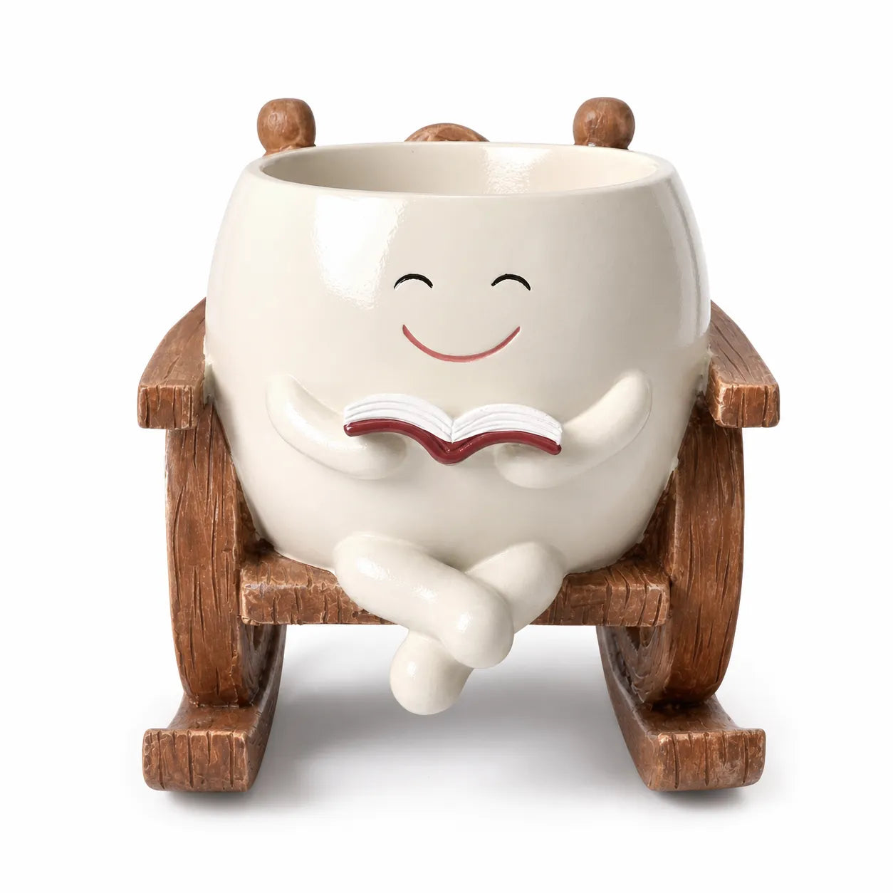 White ceramic character with a smile, sitting on a wooden chair reading a book, on a white background