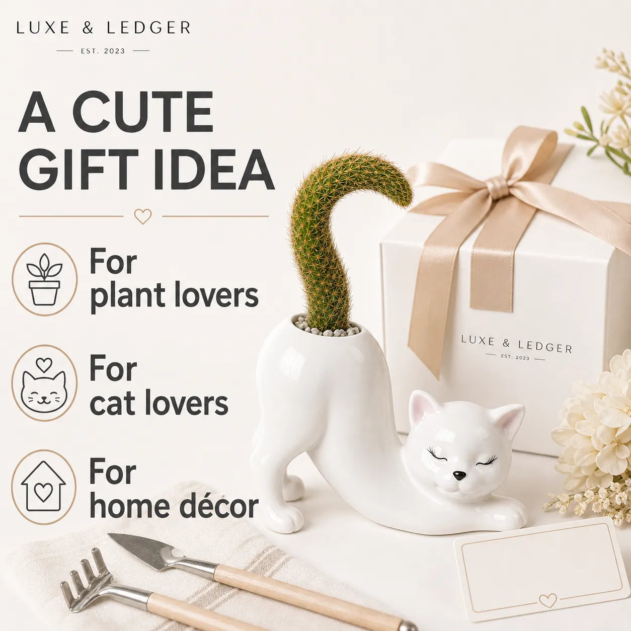 Cat-shaped planter with gift box and gardening tools on a white background, featuring Luxe & Ledger branding.