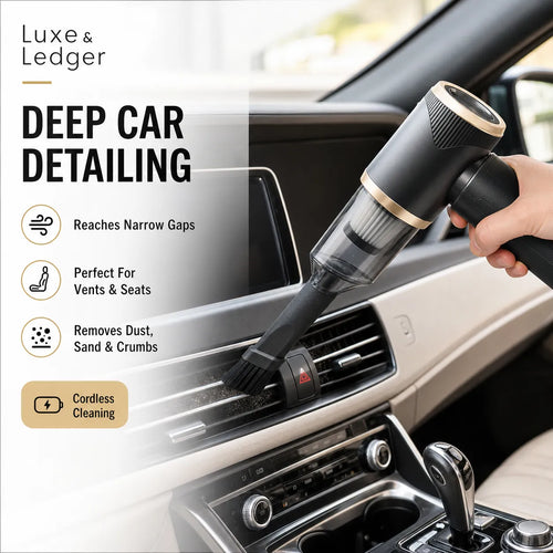 Cordless vacuum cleaner being used to clean a car's air vent with 'Luxe & Ledger' branding.