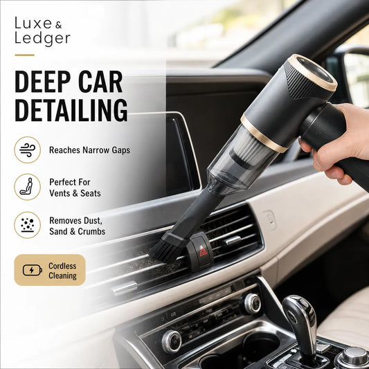Cordless vacuum cleaner being used to clean a car's air vent with 'Luxe & Ledger' branding.
