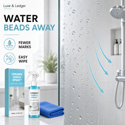 Ceramic shield spray with packaging and towel on a bathroom counter, showing water beads on a glass surface.