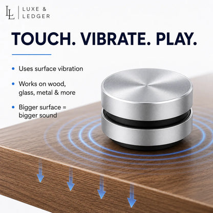 Silver vibration device on a wooden surface with text about its features.