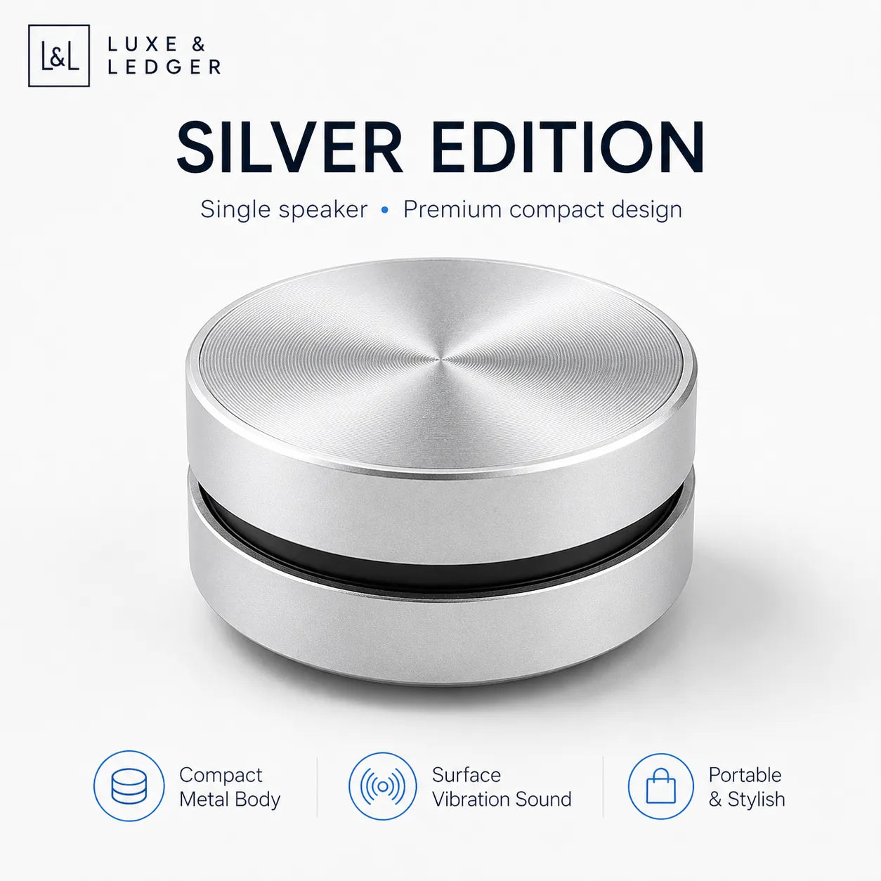 Silver speaker with Luxe & Ledger branding on a white background